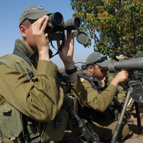 Israeli troops scan the border with Syria.