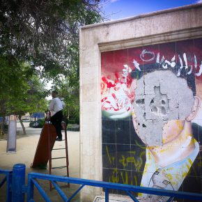 Defaced Assad mural. Raqqa playground, 2013.