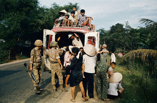 South Vietnamese troops search a truck loaded with fleeing refugees.Hue, 1972.